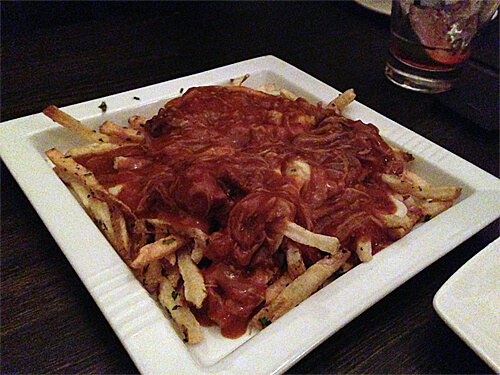 Poutine: Korean braised pork, Quebec curds, and caramelized onions ($12)