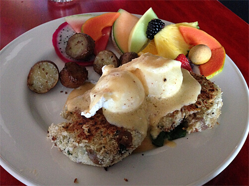 Crab Cake Benny - three kinds of crabmeat, cod, potato and herbs, served on spinach. ($15.95)