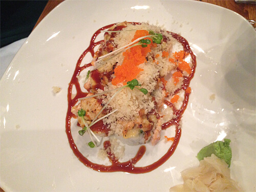 Love Crunch rolls - baked crab, avocado roll with salmon and spicy tuna, tempura bits, sweet soy and tobiko - $17.95