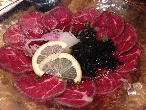 Beef Tataki - seared beef, fresh grated daikon, red onion and green onion with ponzu & sesame dressing - $12.95
