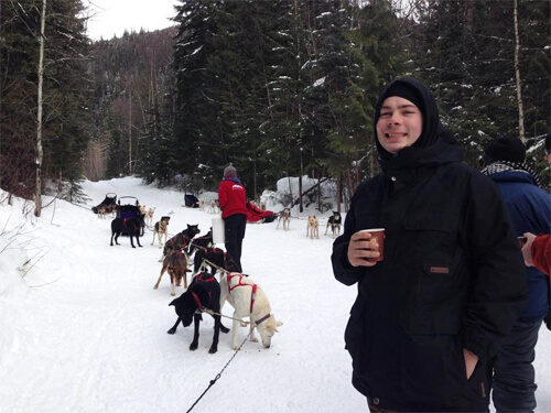 Mike having some hot apple cider after dogsledding in the Canadian Rockies! 