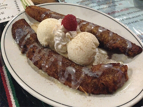 Fried Plantain - plantain sprinkled with cinnamon and sugar, and drizzled with lechera and caramel, served with two scoops of vanilla ice cream. $6.99