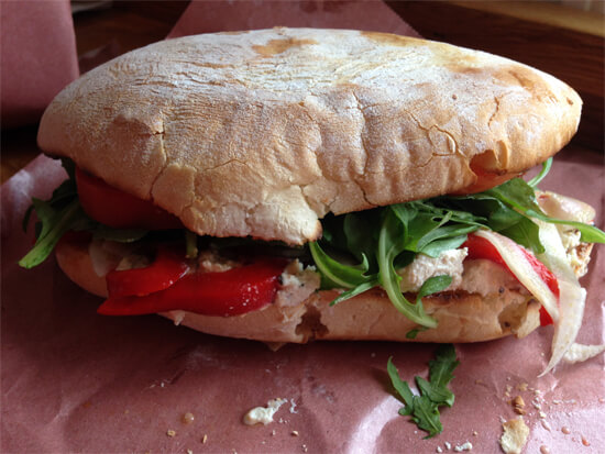 The Welcome Back Ricotta - herb tofu ricotta, pickled fennel, roasted red pepper, tomato, arugula, and balsamic oil ($7.50) at Farrow Sandwiches.